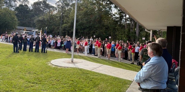 Baldwin HS JROTC Color Guard and MAJ students at the Veterans Day Program in front of Mamie Agnes Jones Elementary School.