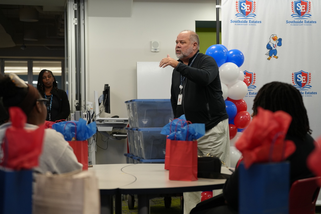 Superintendent Dr. Christopher Bernier speaks to visiting Bethune-Cookman University students inside the classroom.