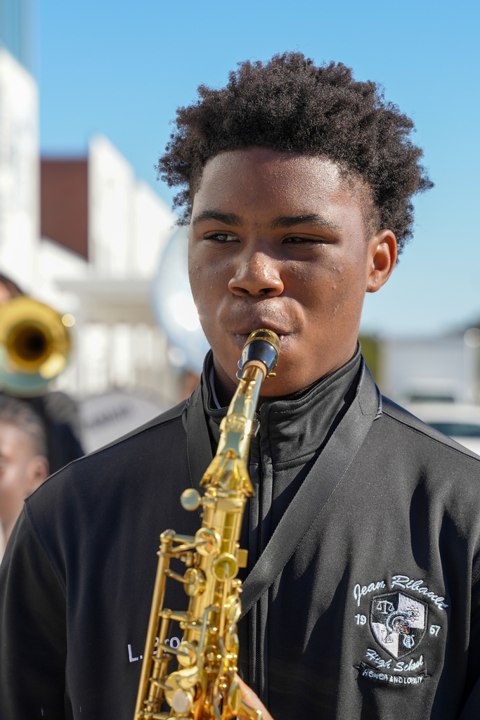 A Jean Ribault High School band member plays an insturment during the welcome performance.