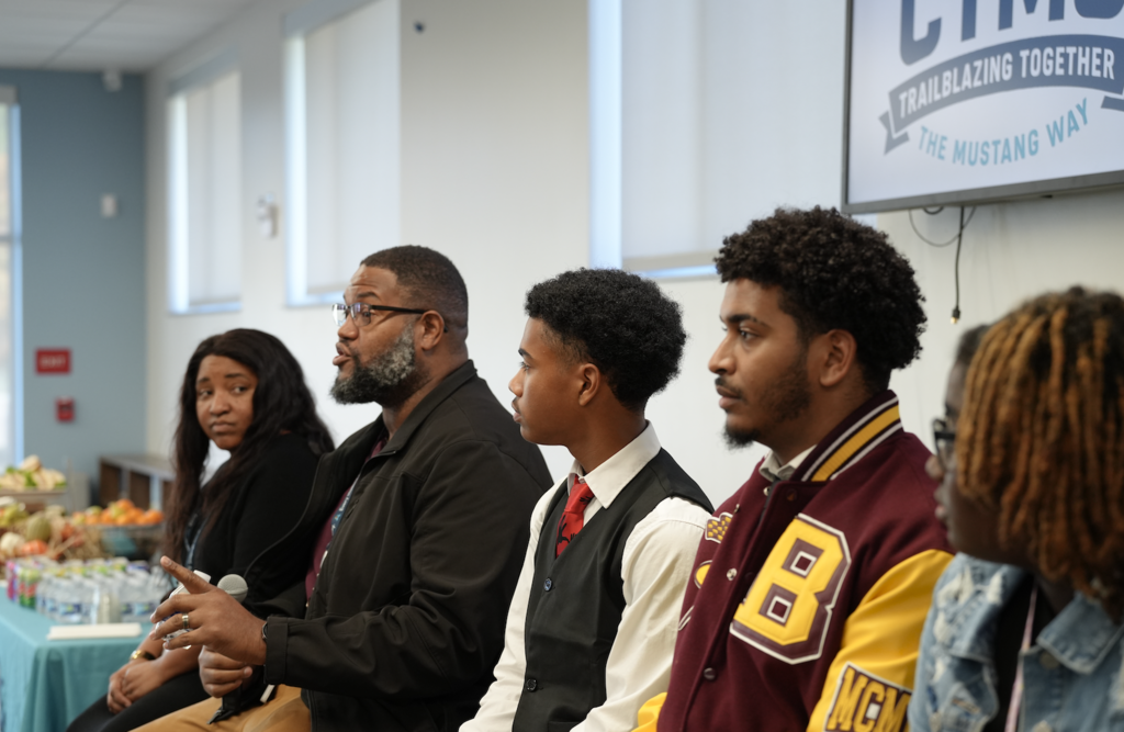 A panelist speaks while students from Bethune-Cookman University listen during the discussion.
