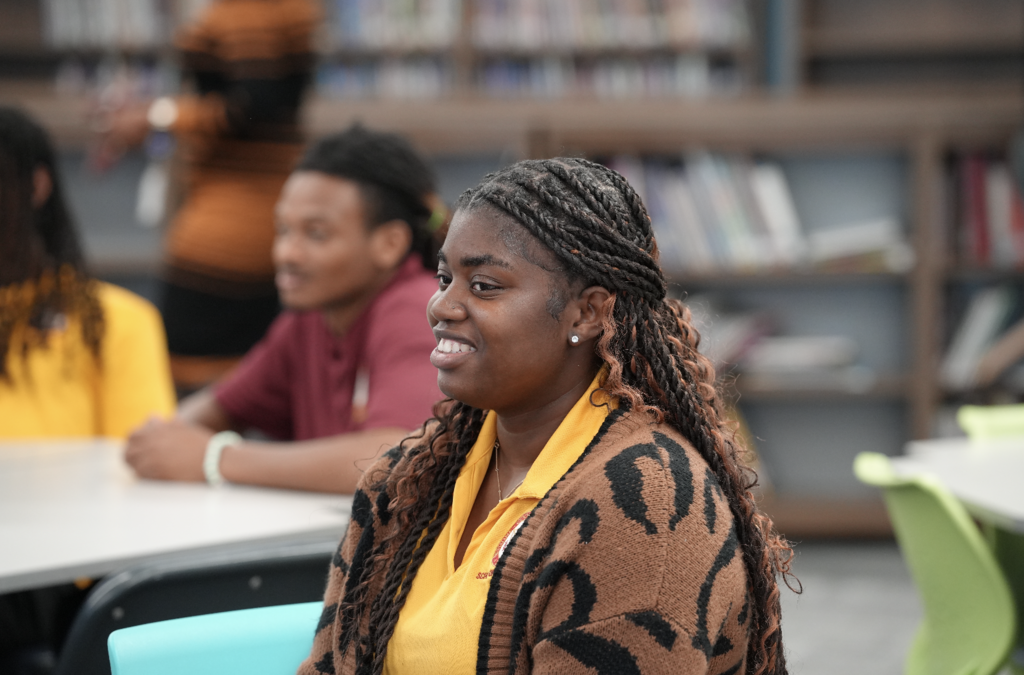 Bethune-Cookman University students seated together, listening to speakers during the visit.