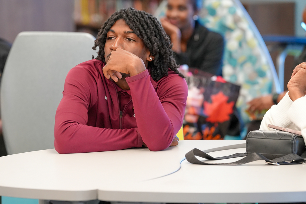 Bethune-Cookman University students seated together, listening to speakers during the visit.