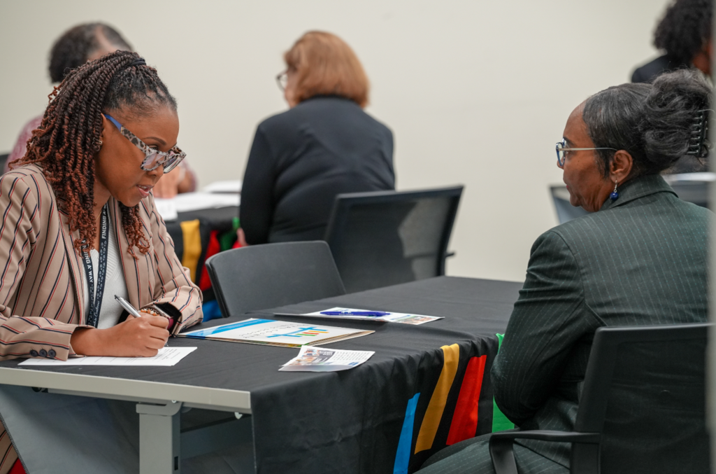 A candidate meets with a DCPS recruiter during the Retired Educators Hiring Fair.