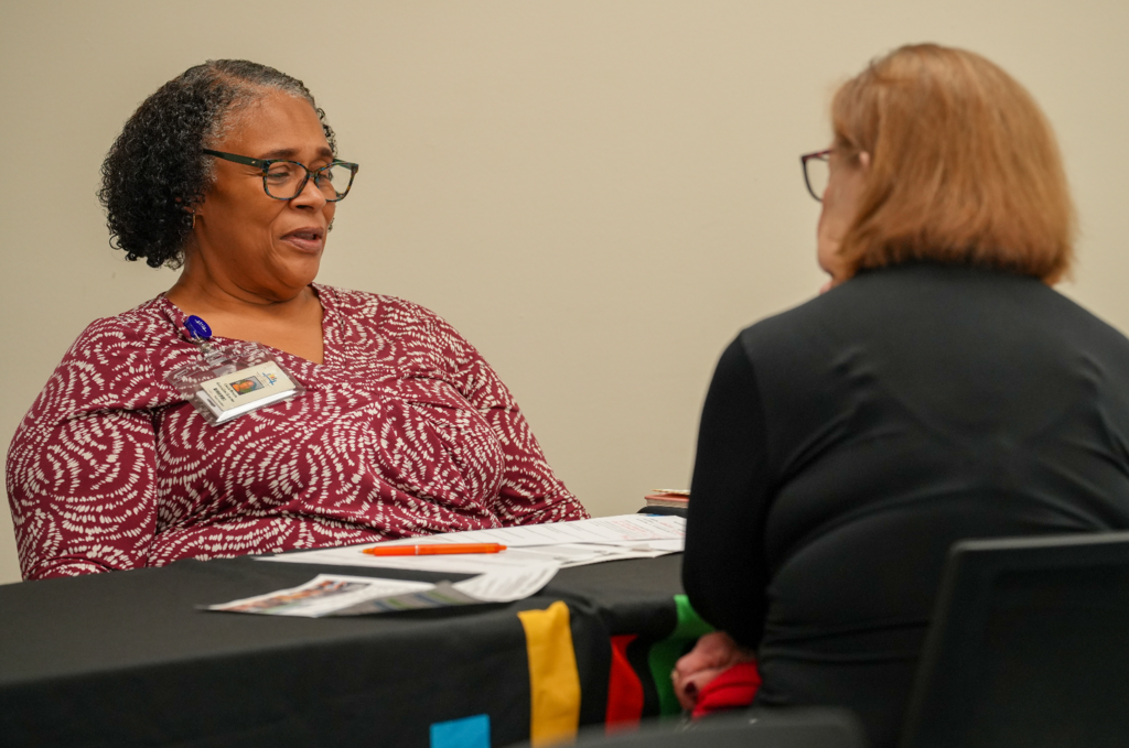 A candidate meets with a DCPS recruiter during the Retired Educators Hiring Fair.