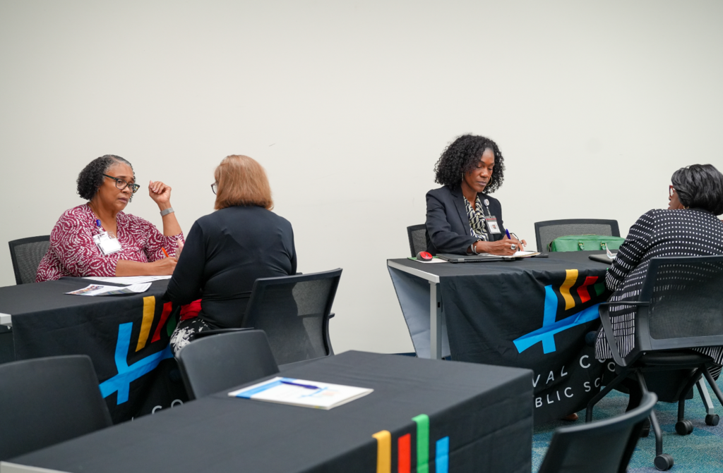 A candidate meets with a DCPS recruiter during the Retired Educators Hiring Fair.