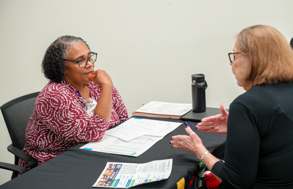 A candidate meets with a DCPS recruiter during the Retired Educators Hiring Fair.