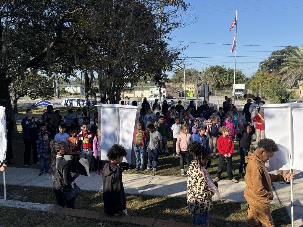 People gathered outside of school