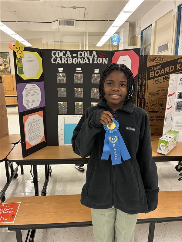 Student with 1st place ribbon