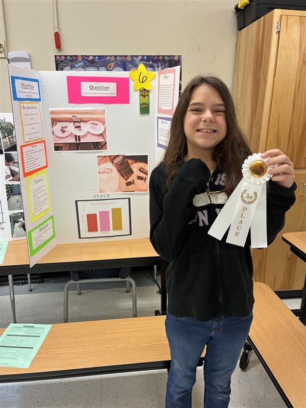 student with 3rd place ribbon