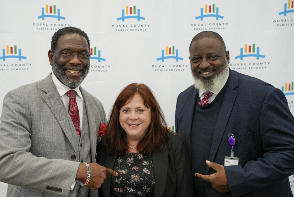 Job Fair at Schultz Center with new hires taking photos.