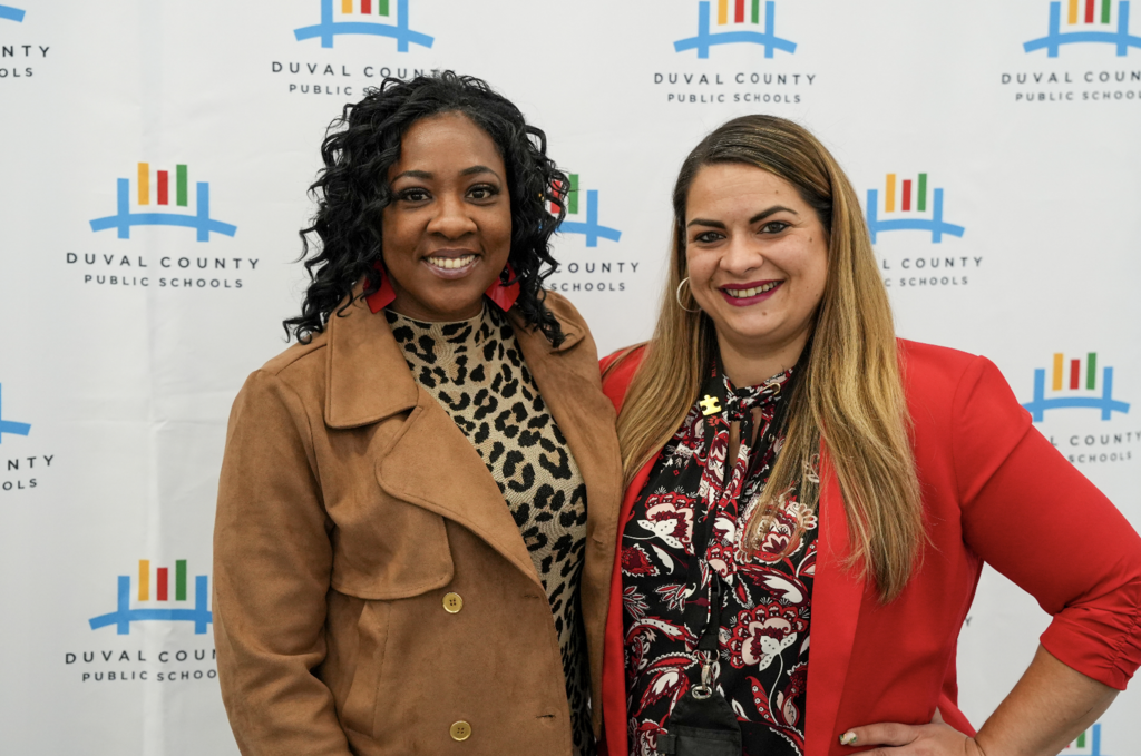 Job Fair at Schultz Center with new hires taking photos.