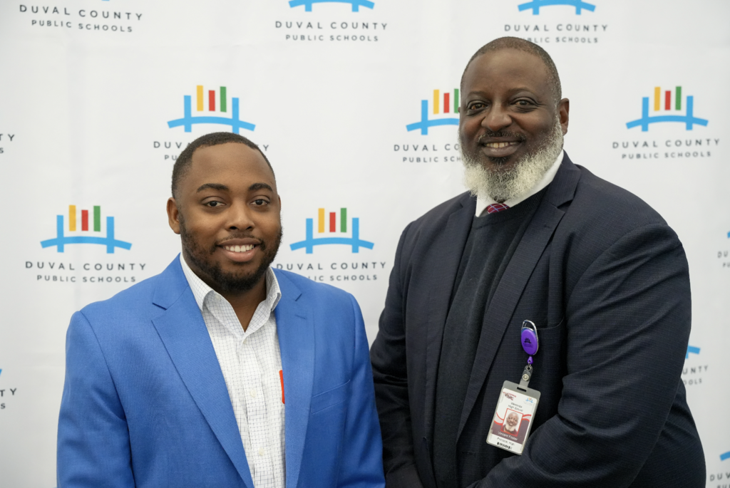 Job Fair at Schultz Center with new hires taking photos.