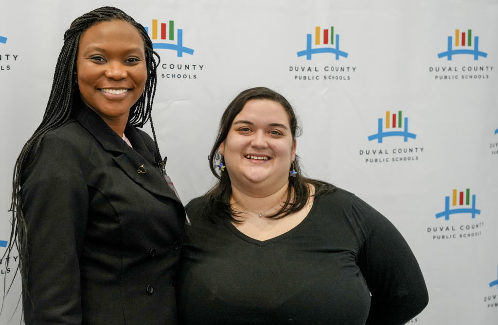 Job Fair at Schultz Center with new hires taking photos.