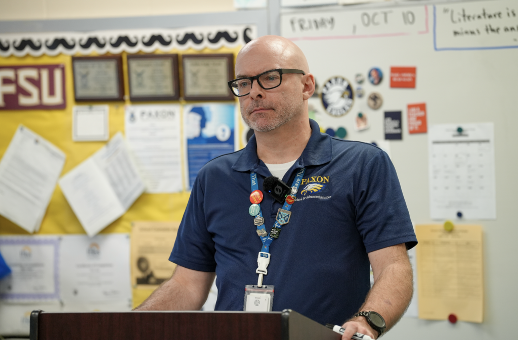 Kevin Smith stands at the front of his classroom speaking to students at Paxon School for Advanced Studies.