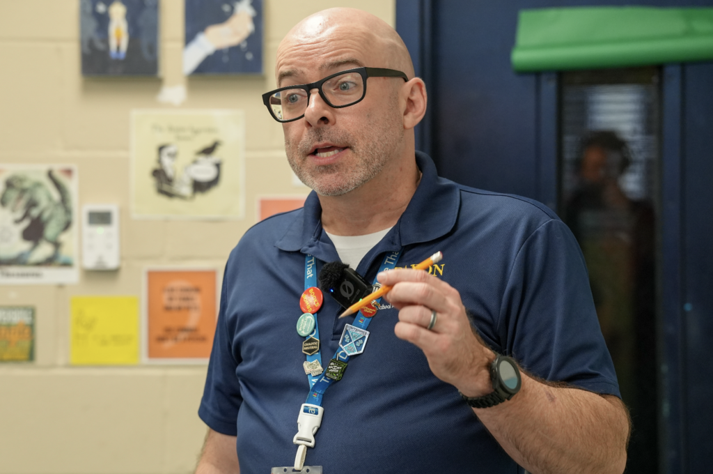 Kevin Smith stands at the front of his classroom speaking to students at Paxon School for Advanced Studies.