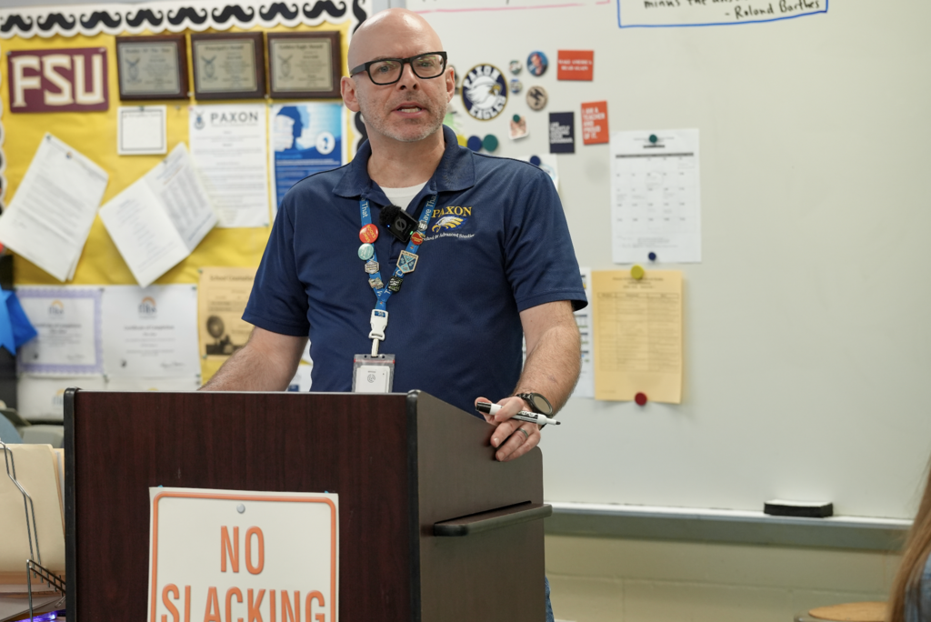 Kevin Smith stands at the front of his classroom speaking to students at Paxon School for Advanced Studies.