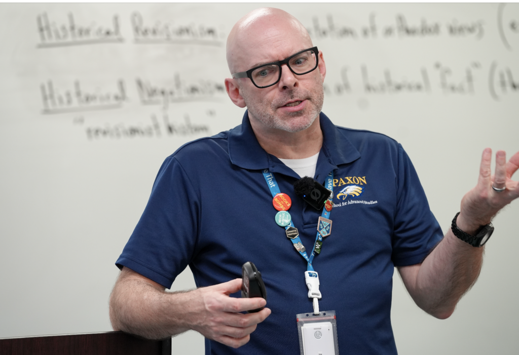 Kevin Smith stands at the front of his classroom speaking to students at Paxon School for Advanced Studies.