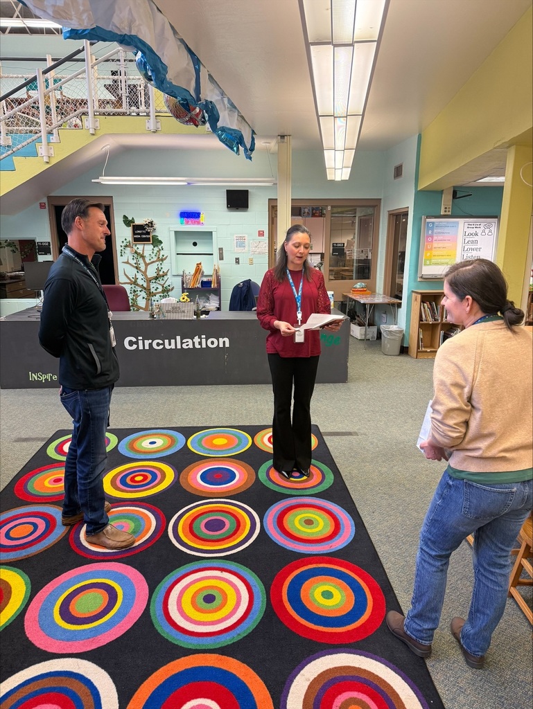 Ms. Perez is presented with the "Unsung Hero" award.