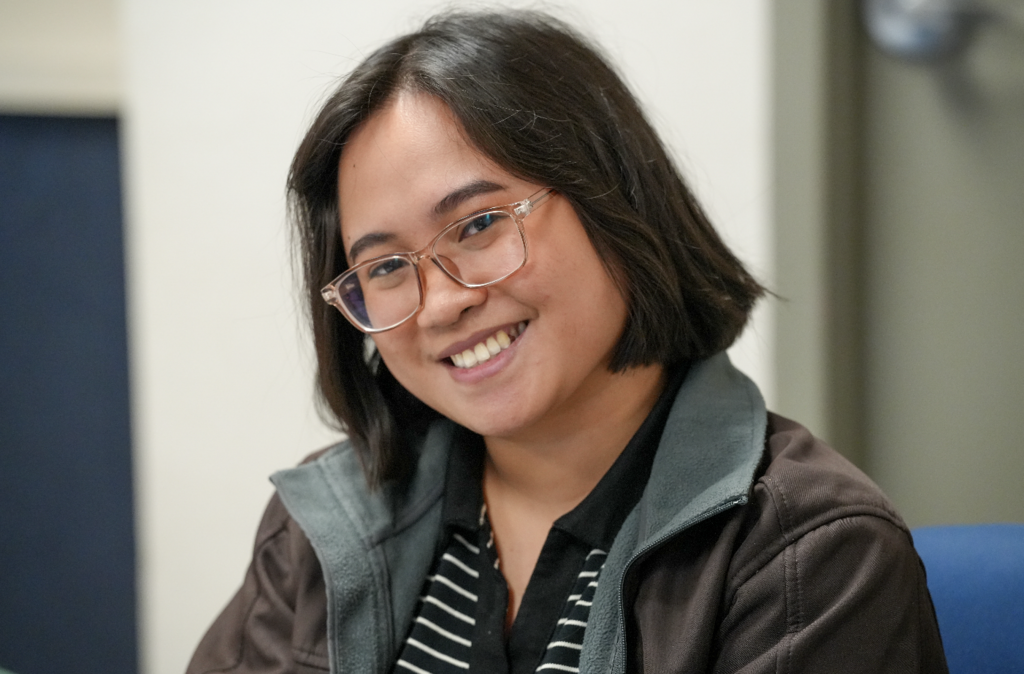 Portrait of a new international teacher smiling while attending onboarding with Duval County Public Schools.