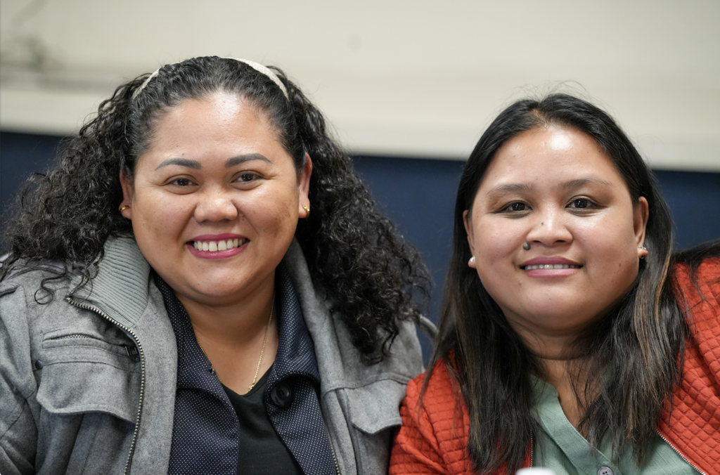 Smiling group of newly hired international teachers seated together during a Duval County Public Schools onboarding session.