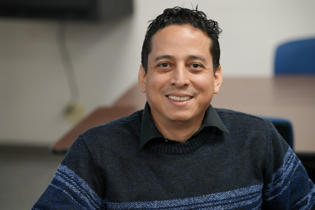 Portrait of a new international teacher smiling while attending onboarding with Duval County Public Schools.