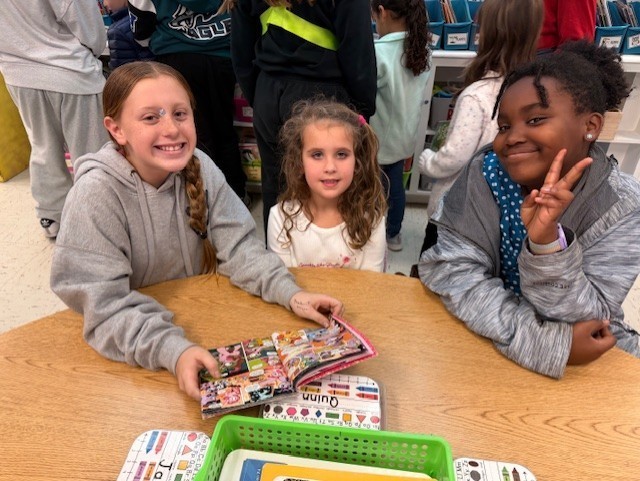 K/5th book buddies reading together