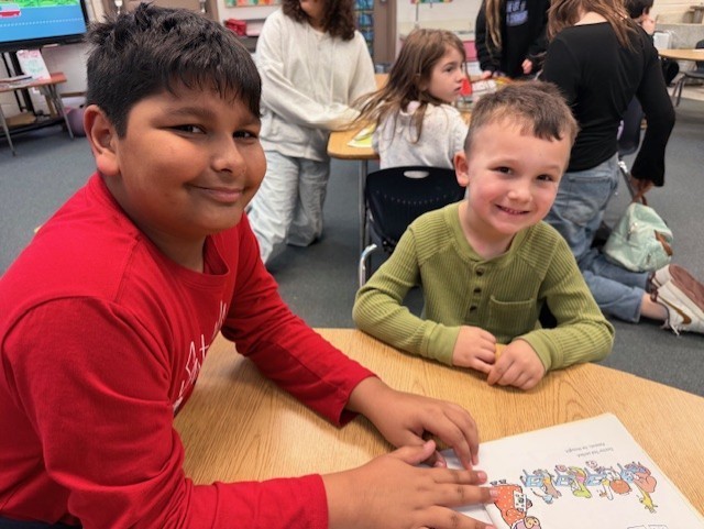 K/5th book buddies reading together
