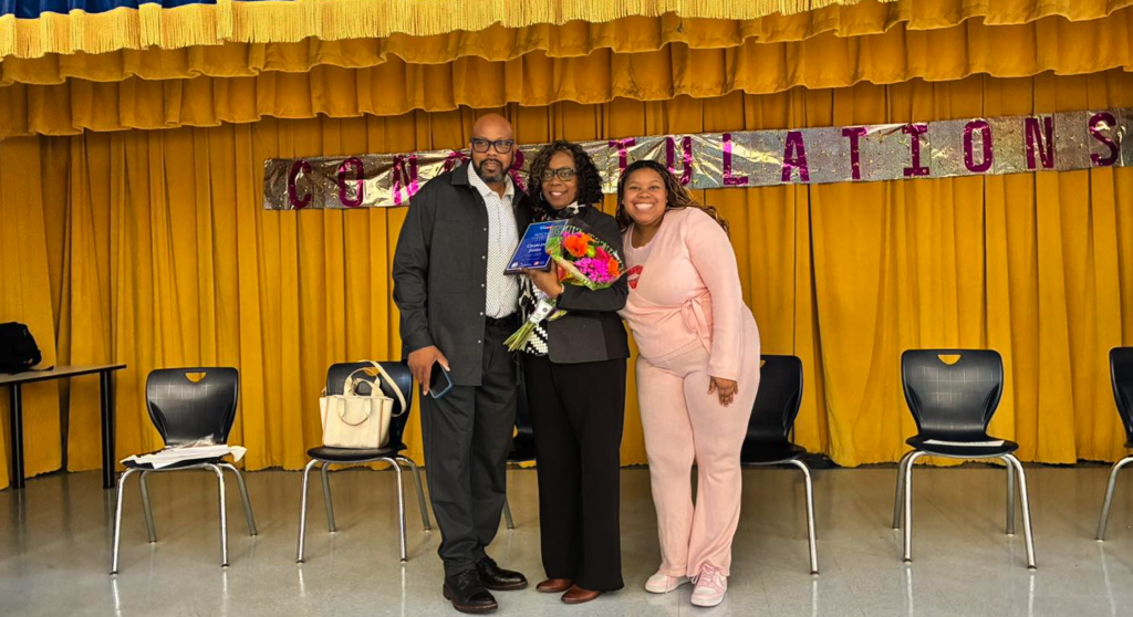 Florida TaxWatch representatives present the Principal Leadership Award to Principal James at George Washington Carver Elementary School.