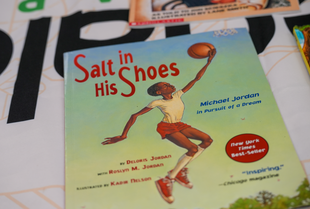 A close-up of a children’s book opened on a table as part of the Real Men Read reading activity.