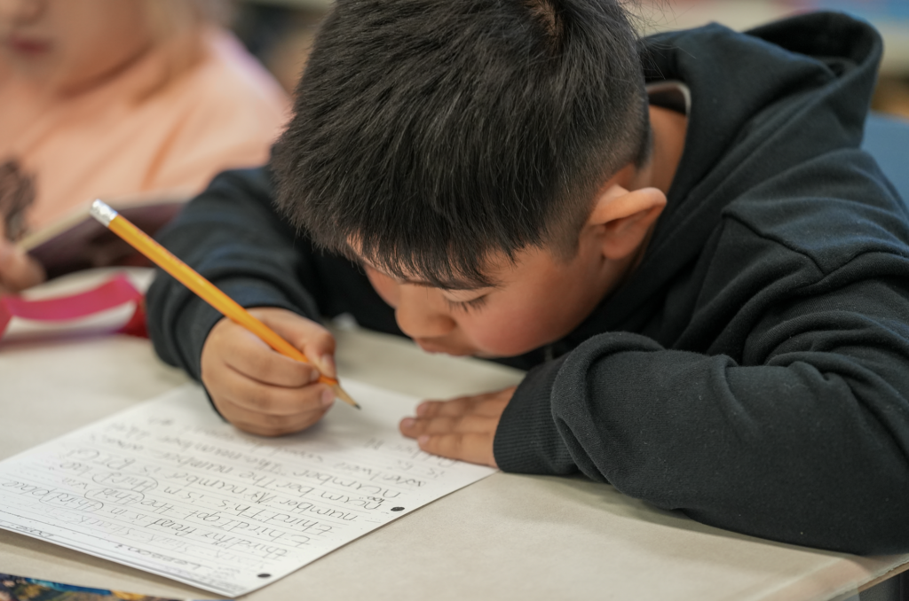 A student works quietly at a desk in Elizabeth Dent’s classroom.