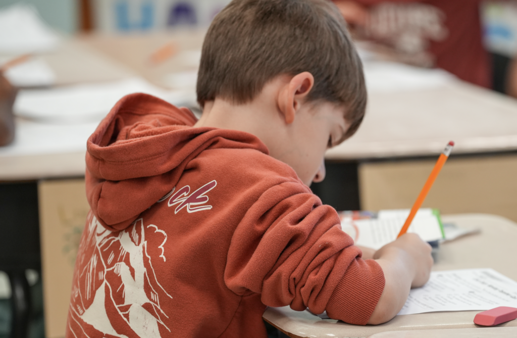 A student works quietly at a desk in Elizabeth Dent’s classroom.