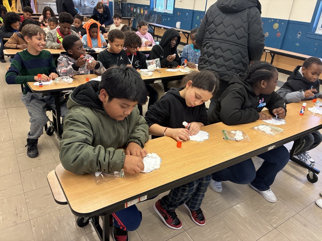 students working on hallway display