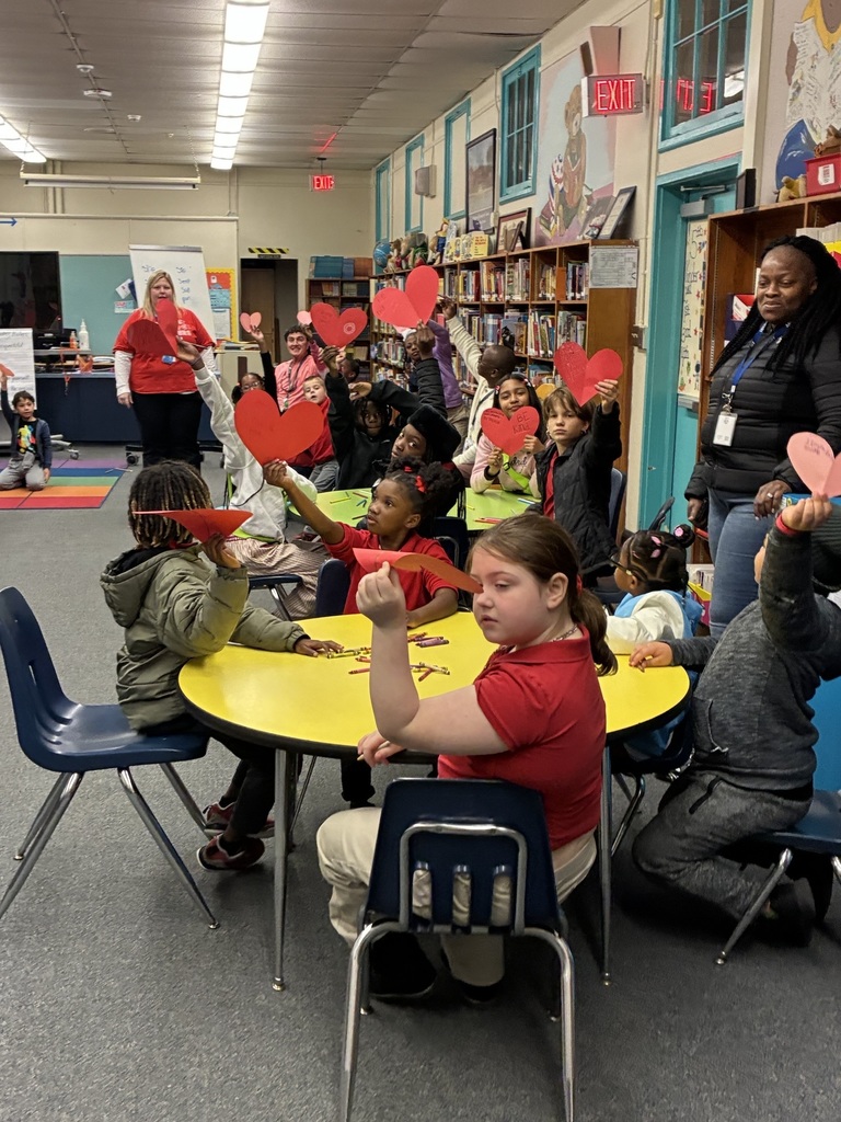 students working on hallway display