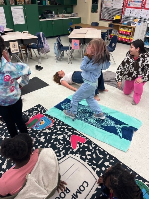 Girls with Pearls at Fort Caroline Elementary School practicing their yoga routine.