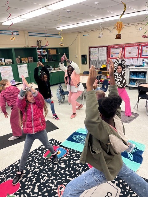 Girls with Pearls at Fort Caroline Elementary School practicing their yoga routine.