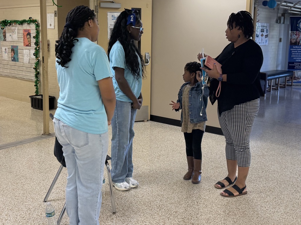 Oceanway Middle School students welcoming families with a Science Map and gifted bag.