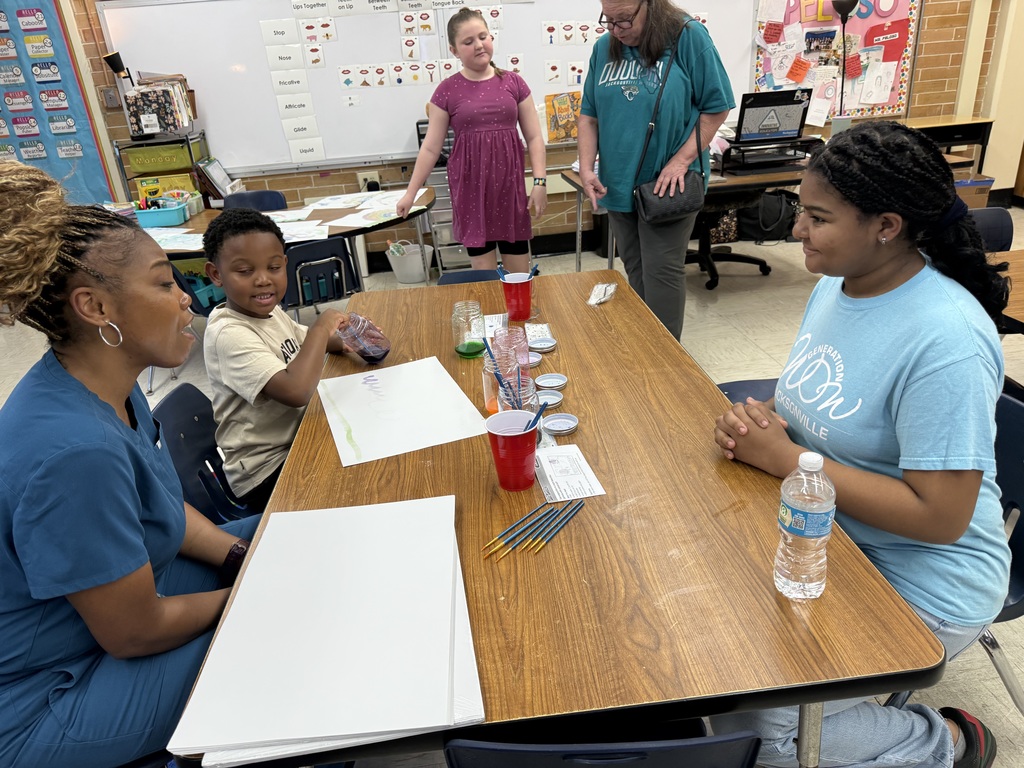 Students using salt and paint with support from an Oceanway Middle School volunteer.