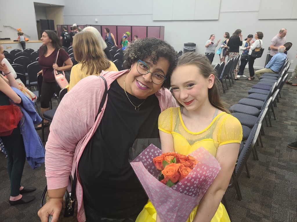 Ms. Denise, a Bus Driver (left) and a student
