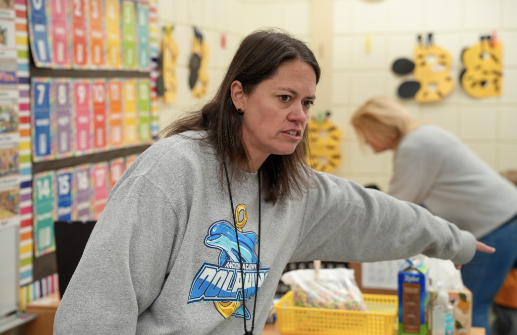 Brittany Barbatelli smiling while engaging with students during a classroom lesson.