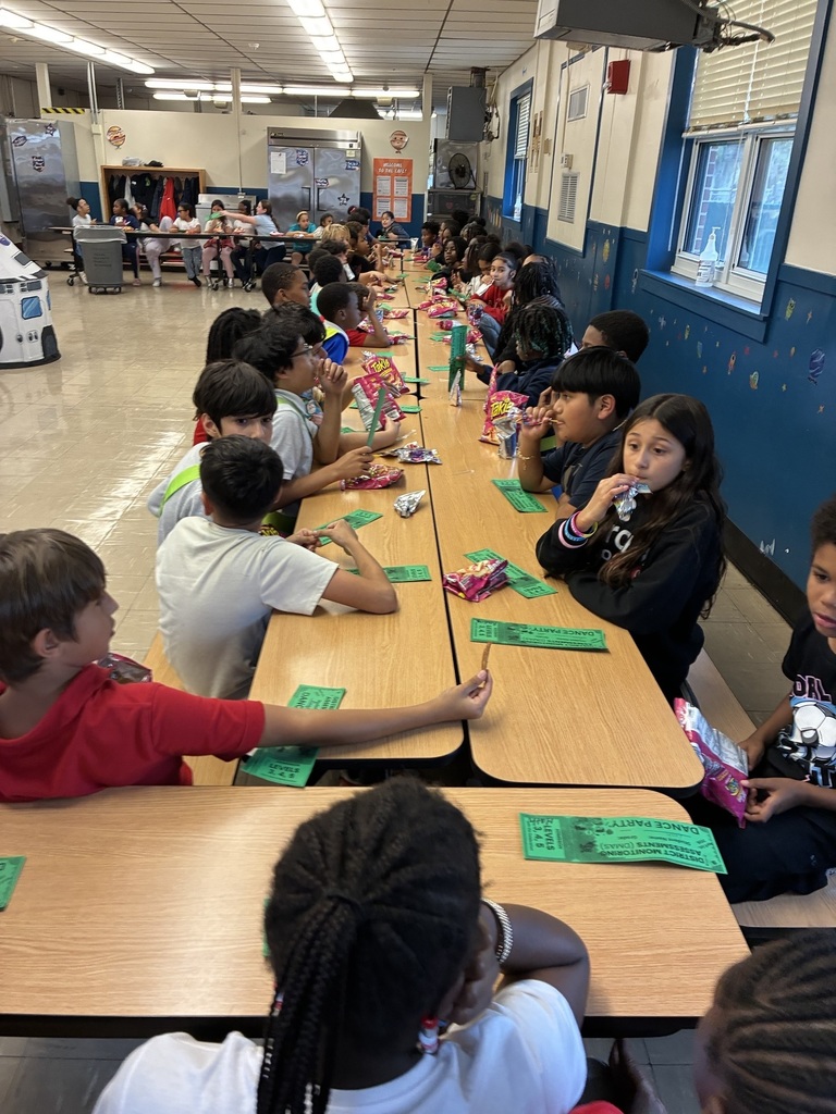students with snacks and dance tickets