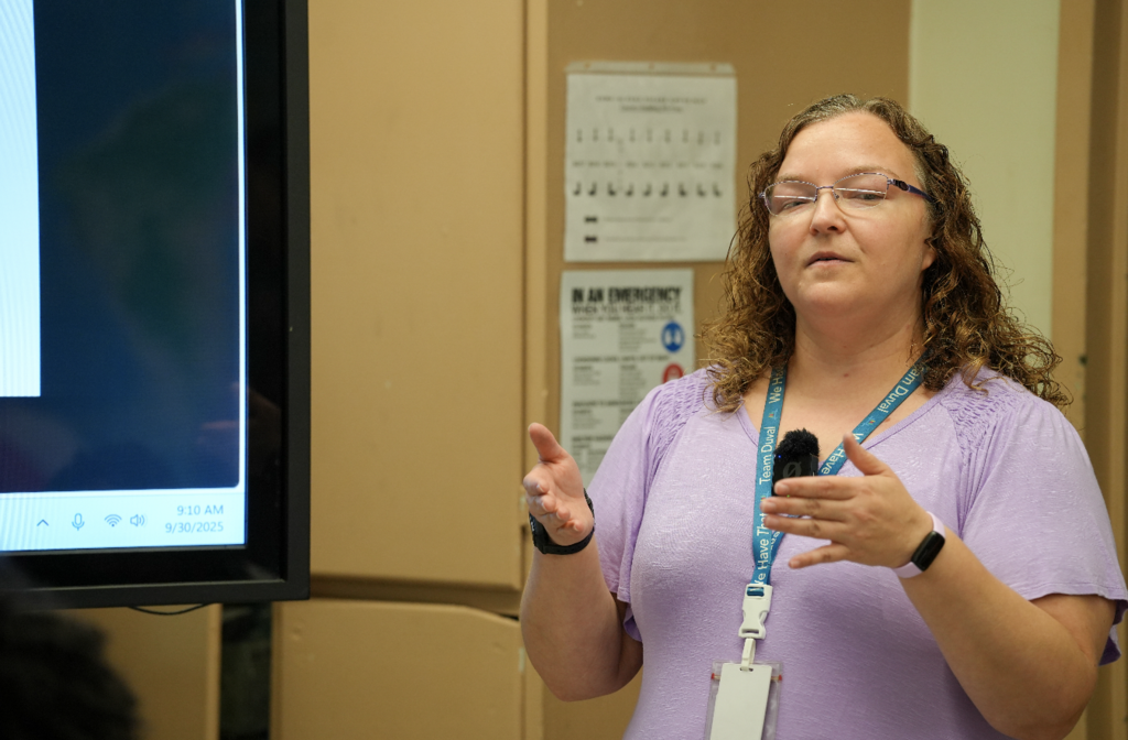 Rebecca LaMance gestures with her hands while teaching during a U.S. History lesson.