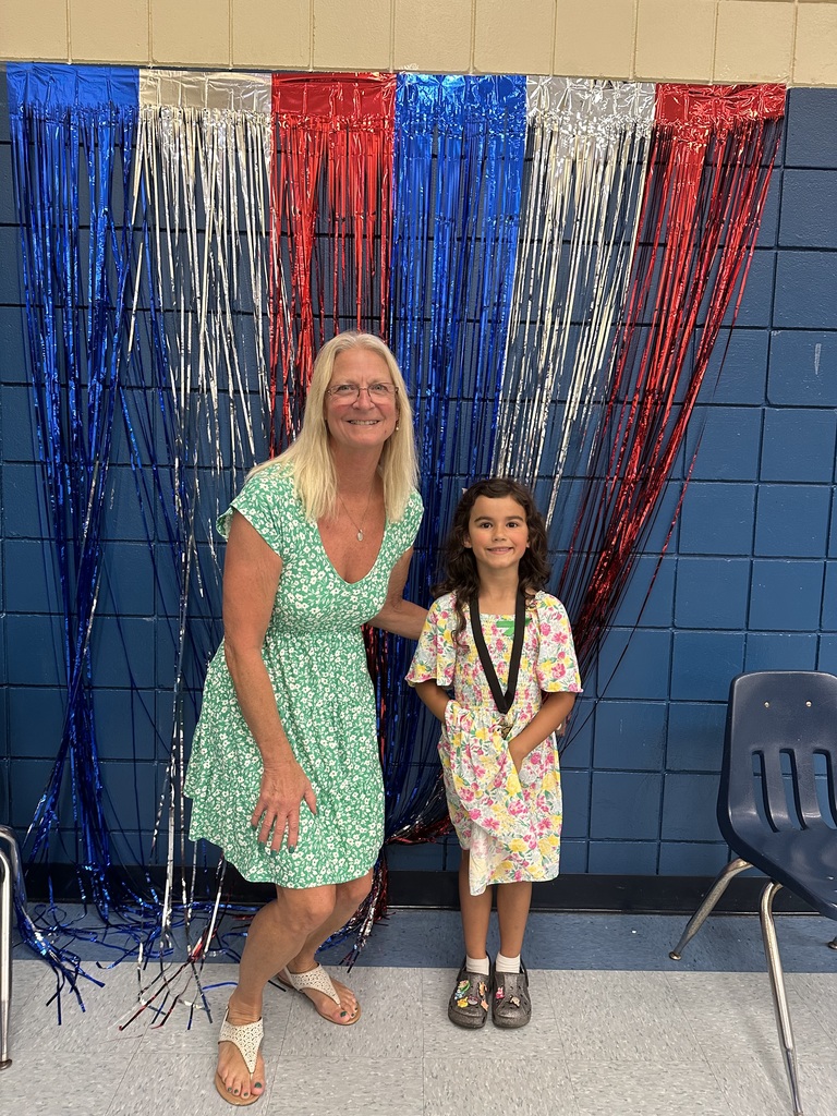 Mrs. Mathis Anchor Academy posing with a student