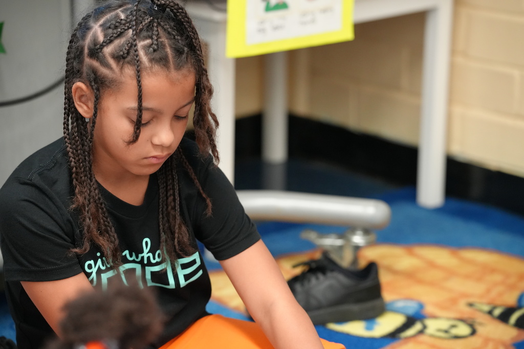 Kadi Welty helps a student during a lesson.