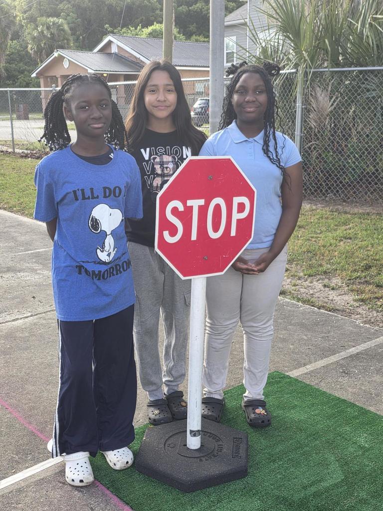 Students with stop sign