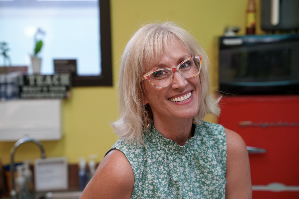 Lyndzee McClure smiling in classroom.