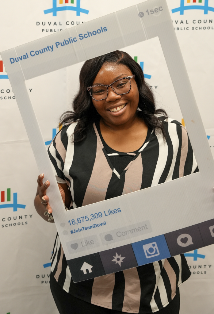 Individual attendee smiling at the Duval County Public Schools hiring fair