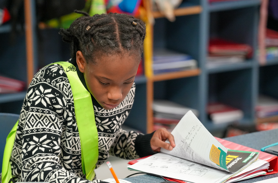Student working on assignment with pencil