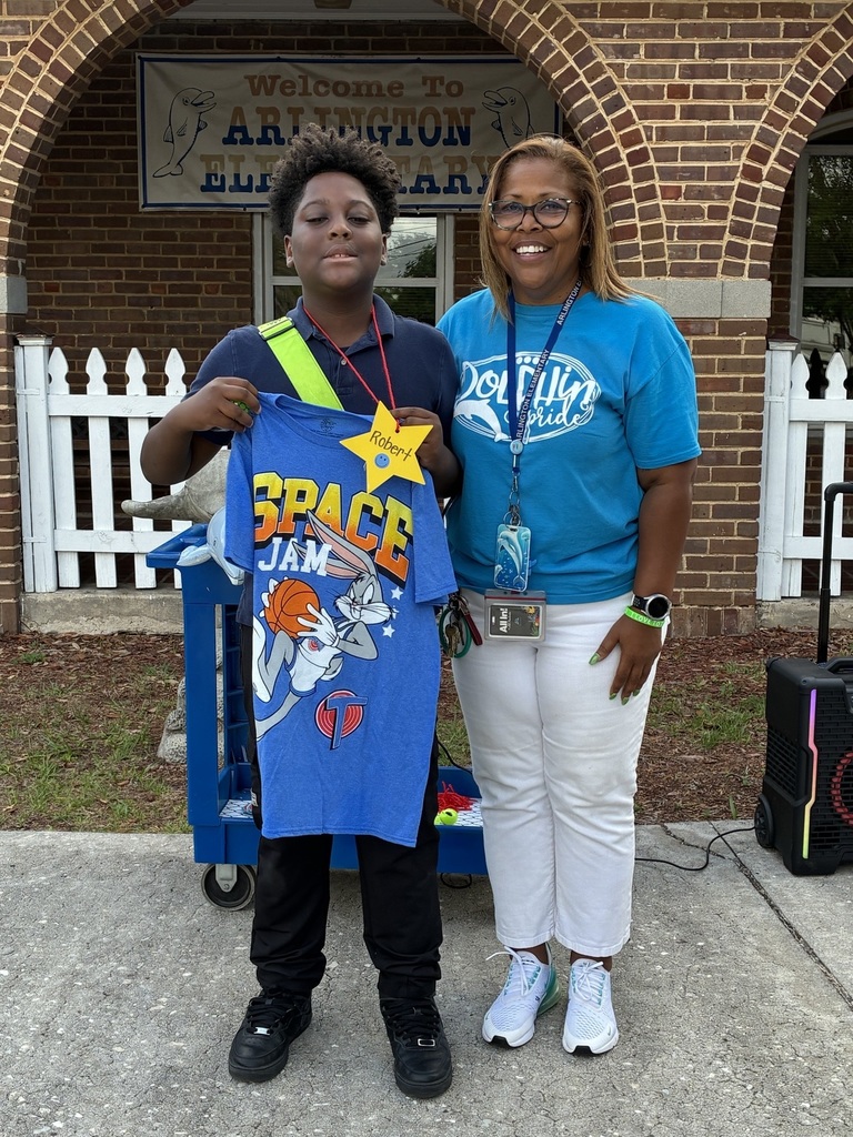 student posing with principal