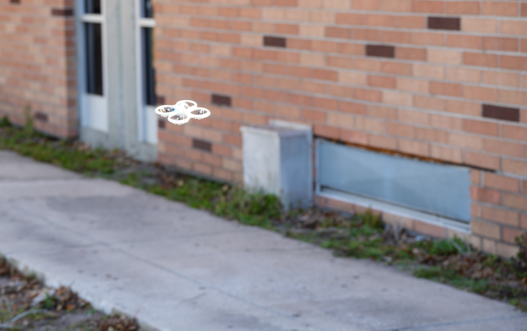 Close-up of a drone in flight during class