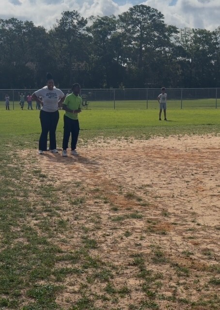 Doctor RG with a student on 1st base